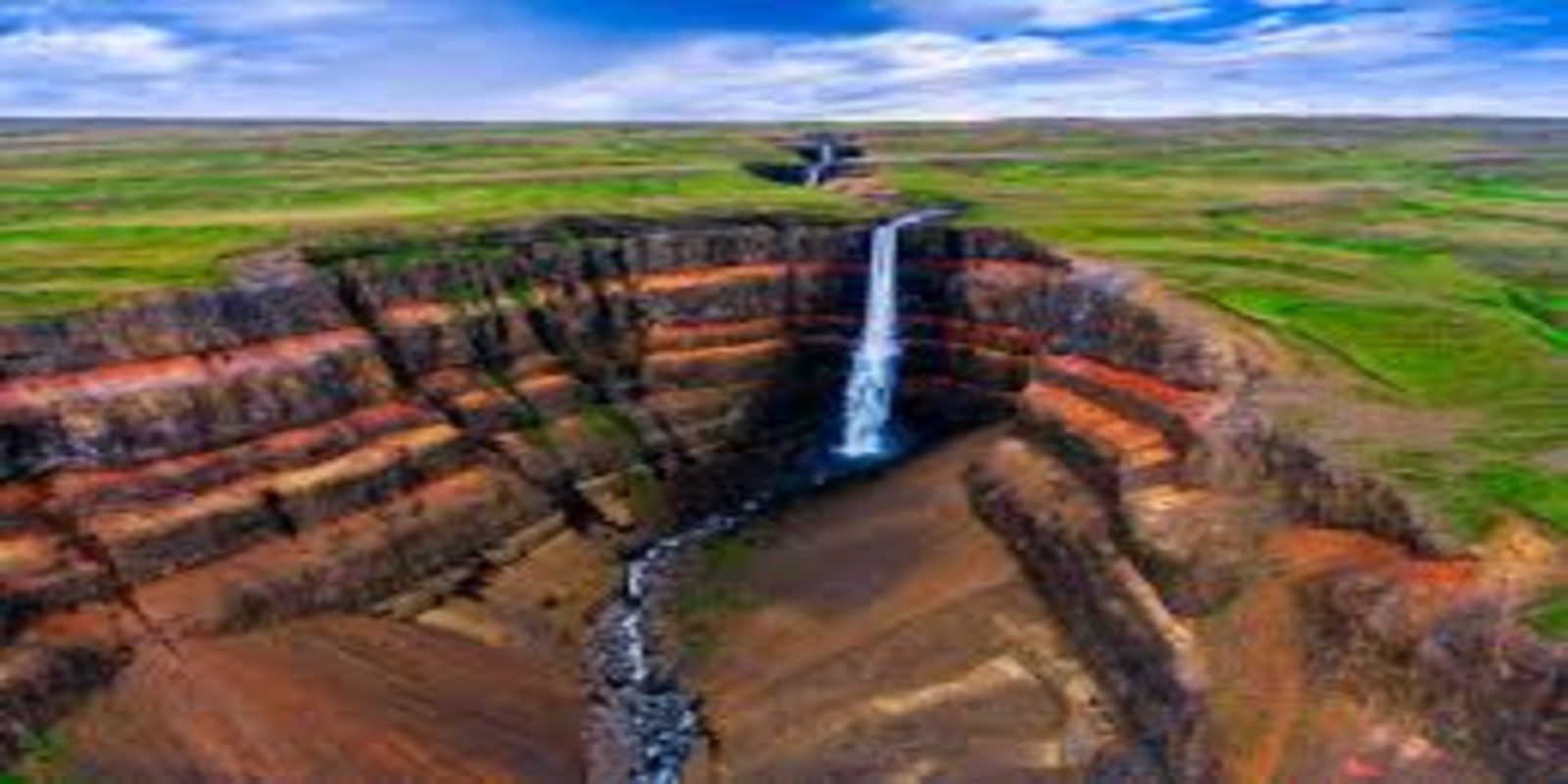 Hengifoss Waterfall Hike: How to Visit Iceland’s Striped Red Canyon Falls